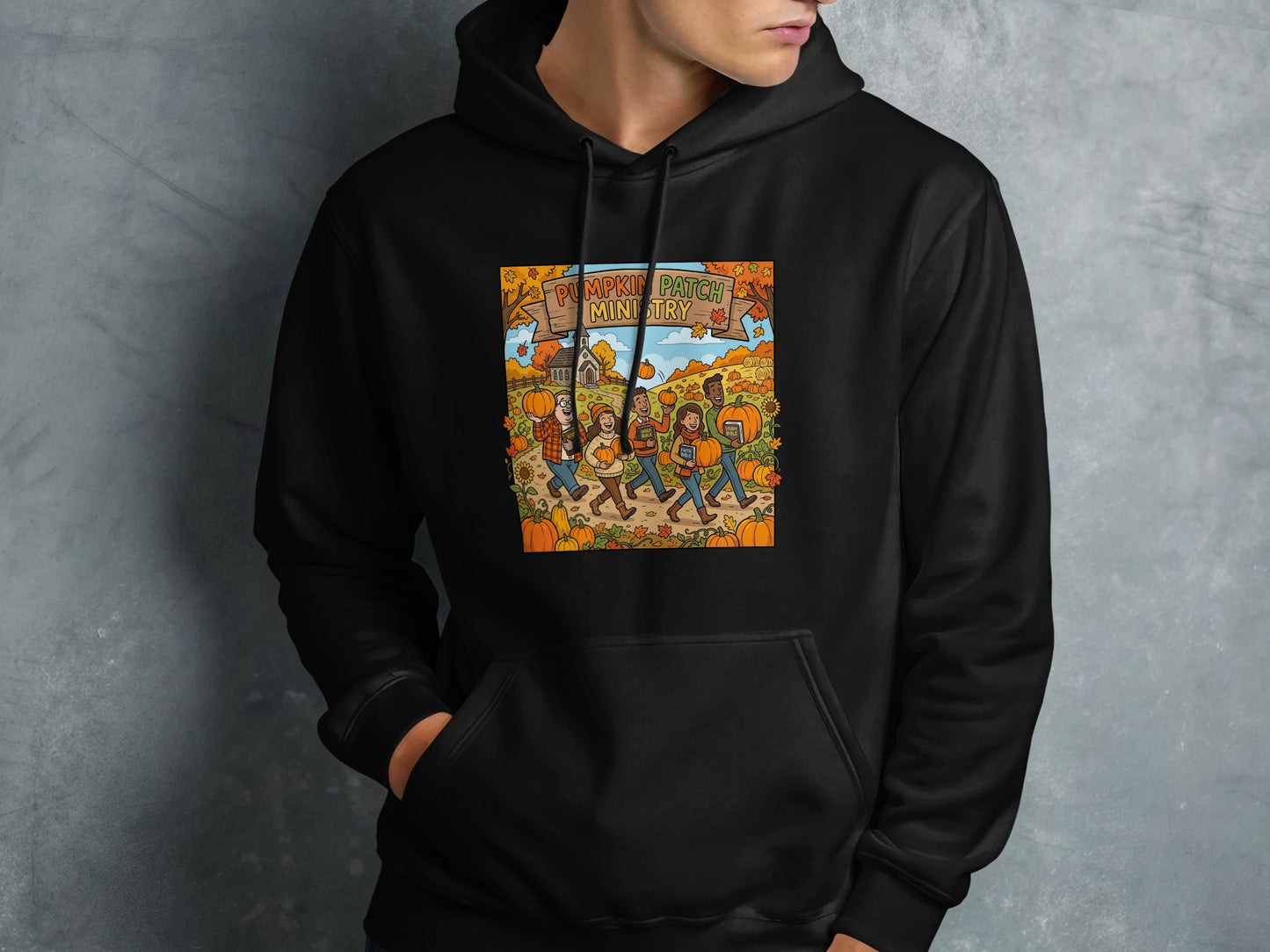 Black hoodie with a graphic of people walking through a pumpkin patch.
