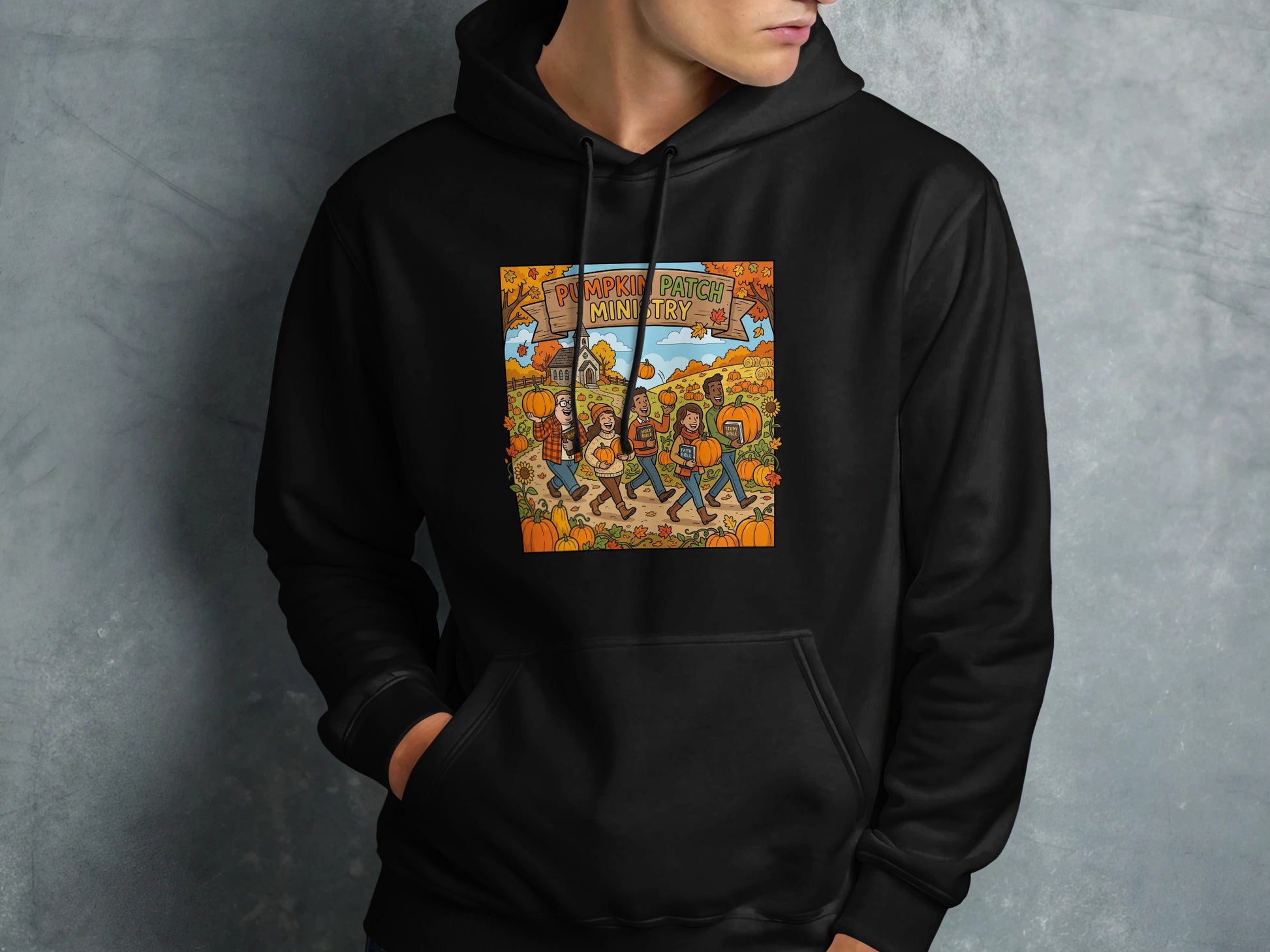 Black hoodie with a graphic of people walking through a pumpkin patch.