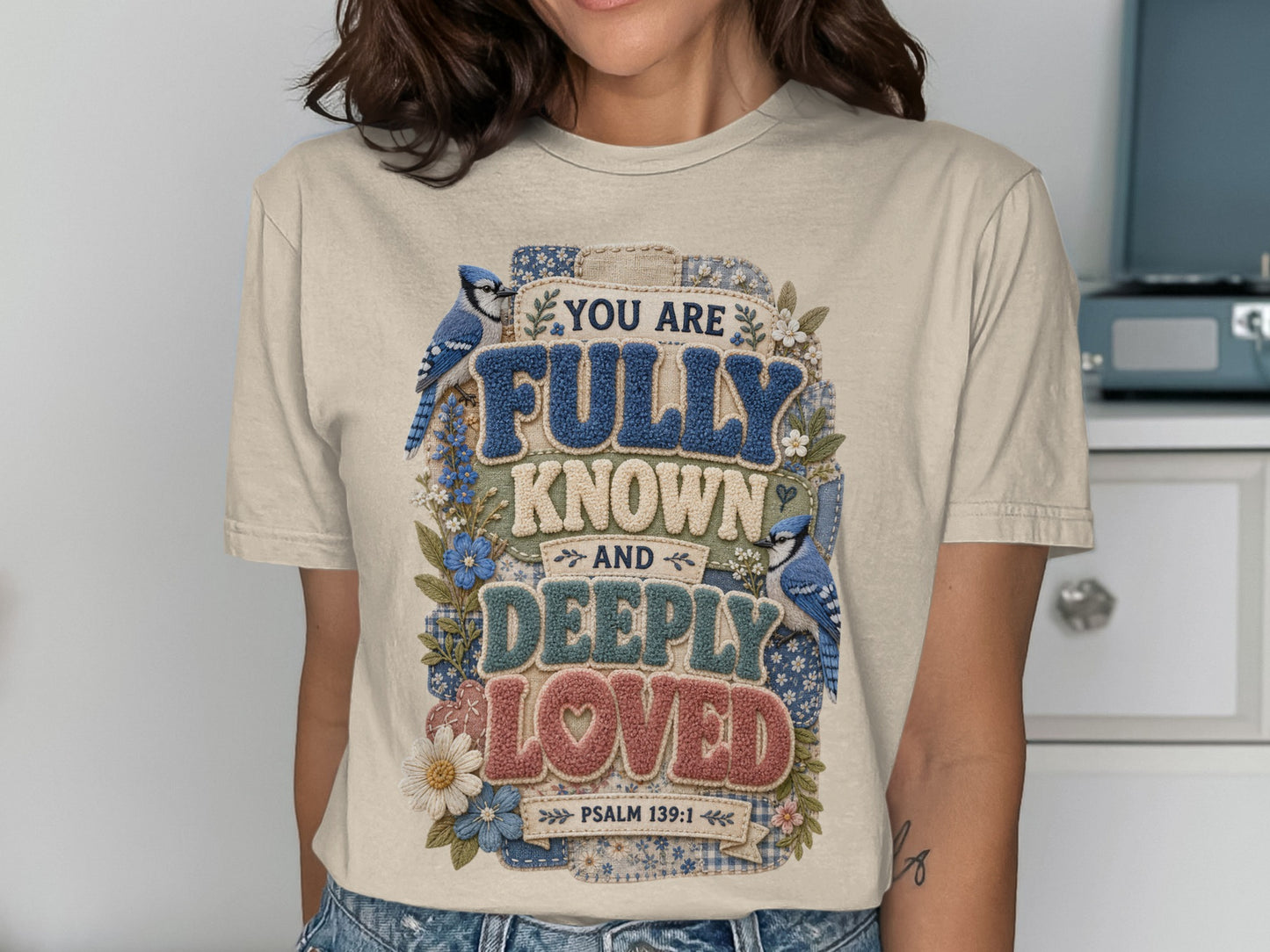 T-shirt with blue birds and flowers, reading "You are Fully Known and Deeply Loved."