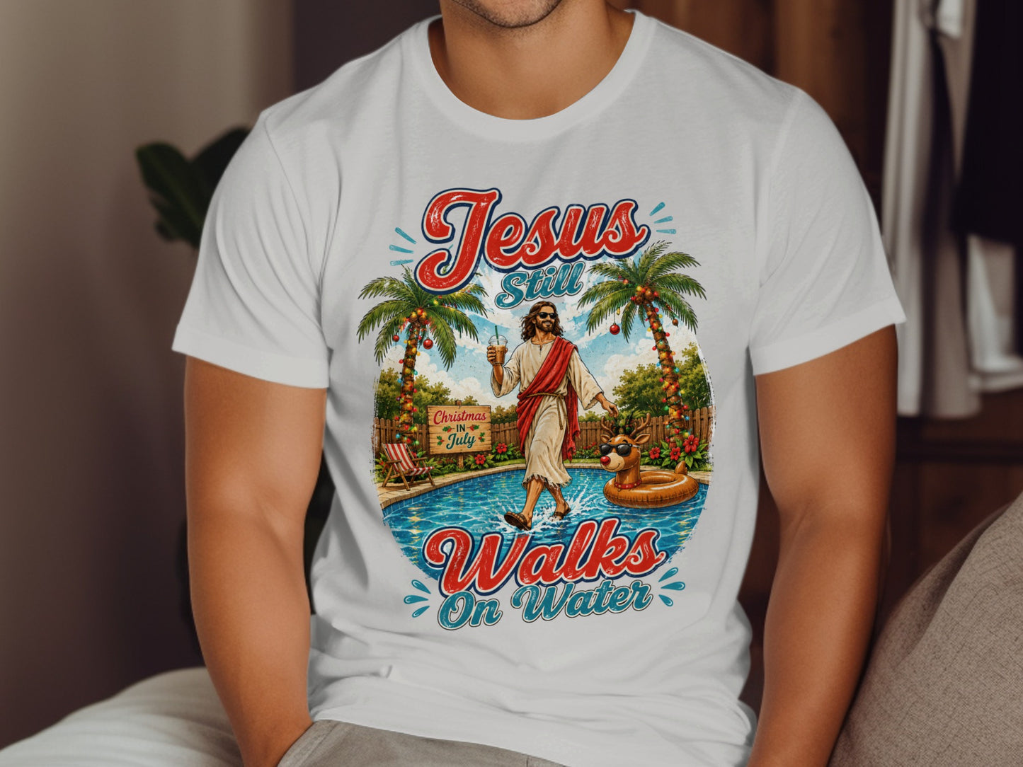 White t-shirt with "Jesus Still Walks On Water" graphic featuring Jesus by a pool.