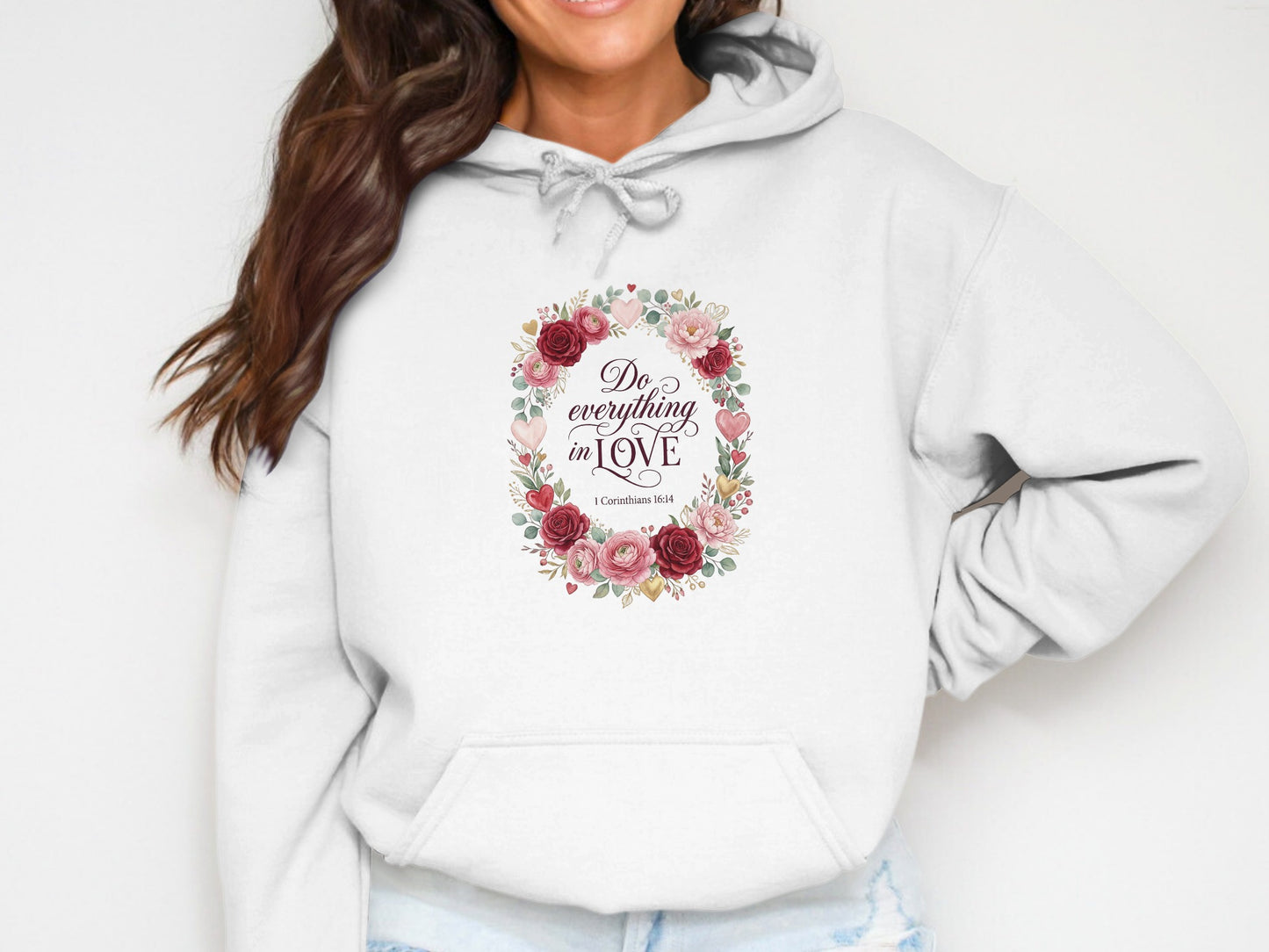White hoodie with floral wreath and "Do everything in LOVE" text.