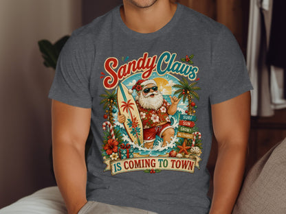 Santa in Hawaiian shirt surfs a wave, "Sandy Claws is Coming to Town" text.