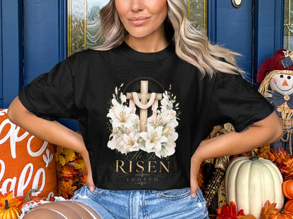 Black t-shirt with a cross, flowers, and text "He Is Risen Indeed".
