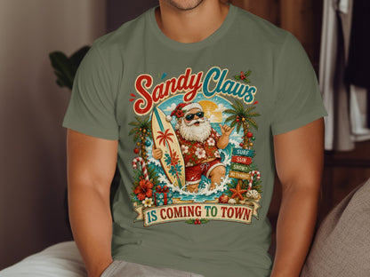 Santa Claus on a surfboard with "Sandy Claws" text.