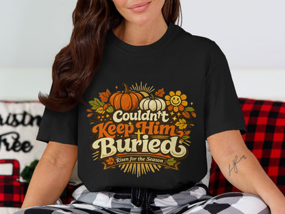 Black t-shirt with pumpkins and text "Couldn't Keep Him Buried Risen for the Season".