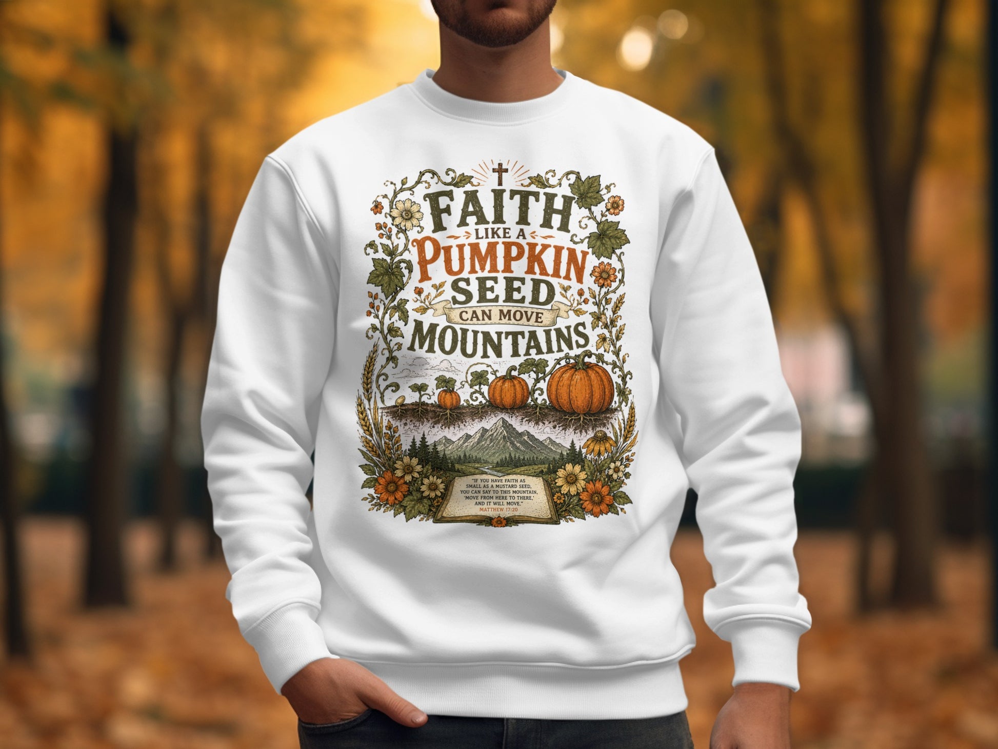 White sweatshirt with "Faith Like a Pumpkin Seed" design and Bible verse.