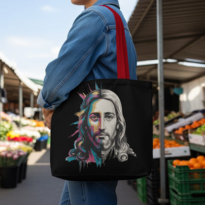 Black tote bag featuring a colorful, half-monochromatic portrait of Jesus.