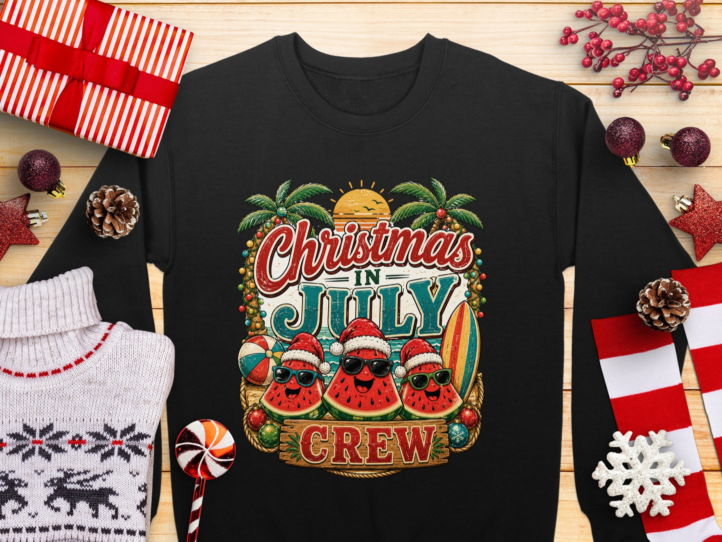 Black sweatshirt with "Christmas in July Crew" text and festive watermelon graphics.