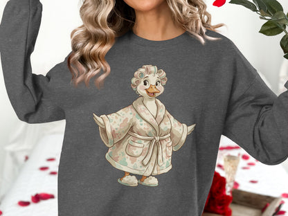 Duck character in a robe and curlers, wearing a grey sweatshirt.