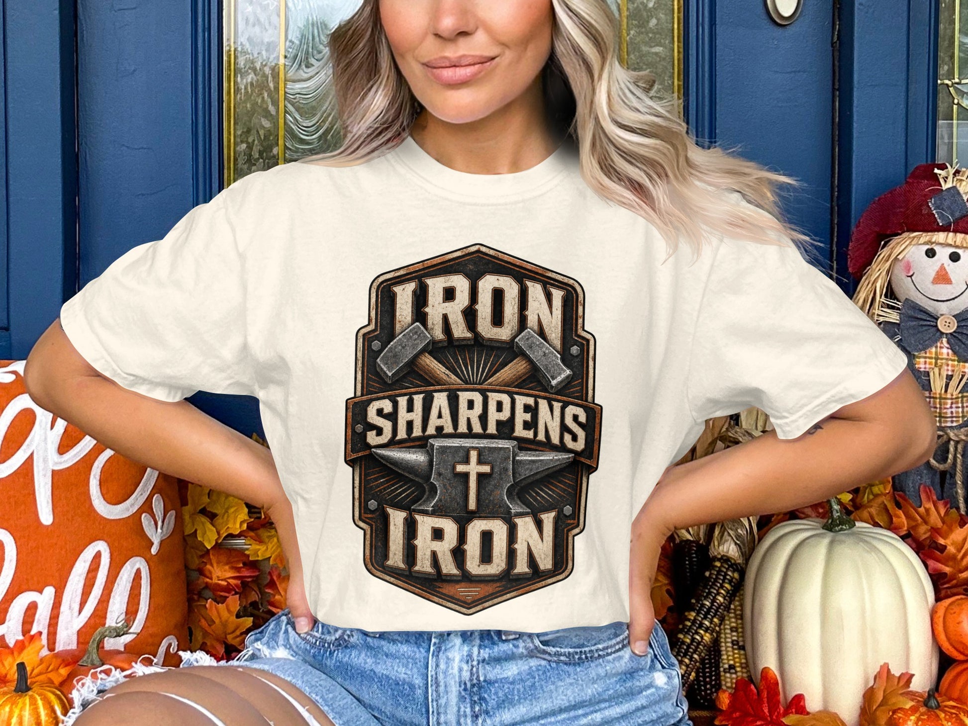 White t-shirt with "Iron Sharpens Iron" text and anvil graphic.