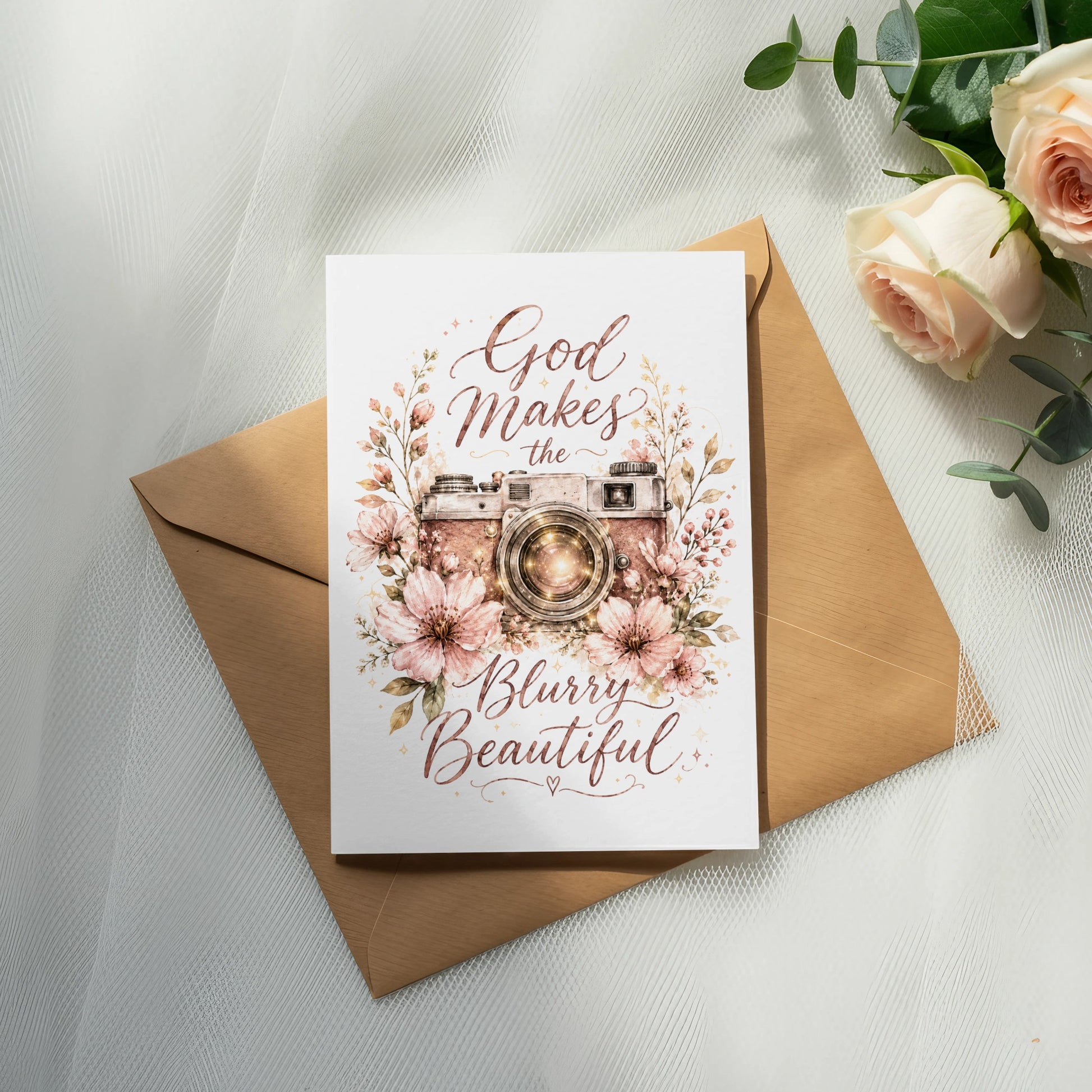 Card with vintage camera, flowers, and text "God Makes the Blurry Beautiful".
