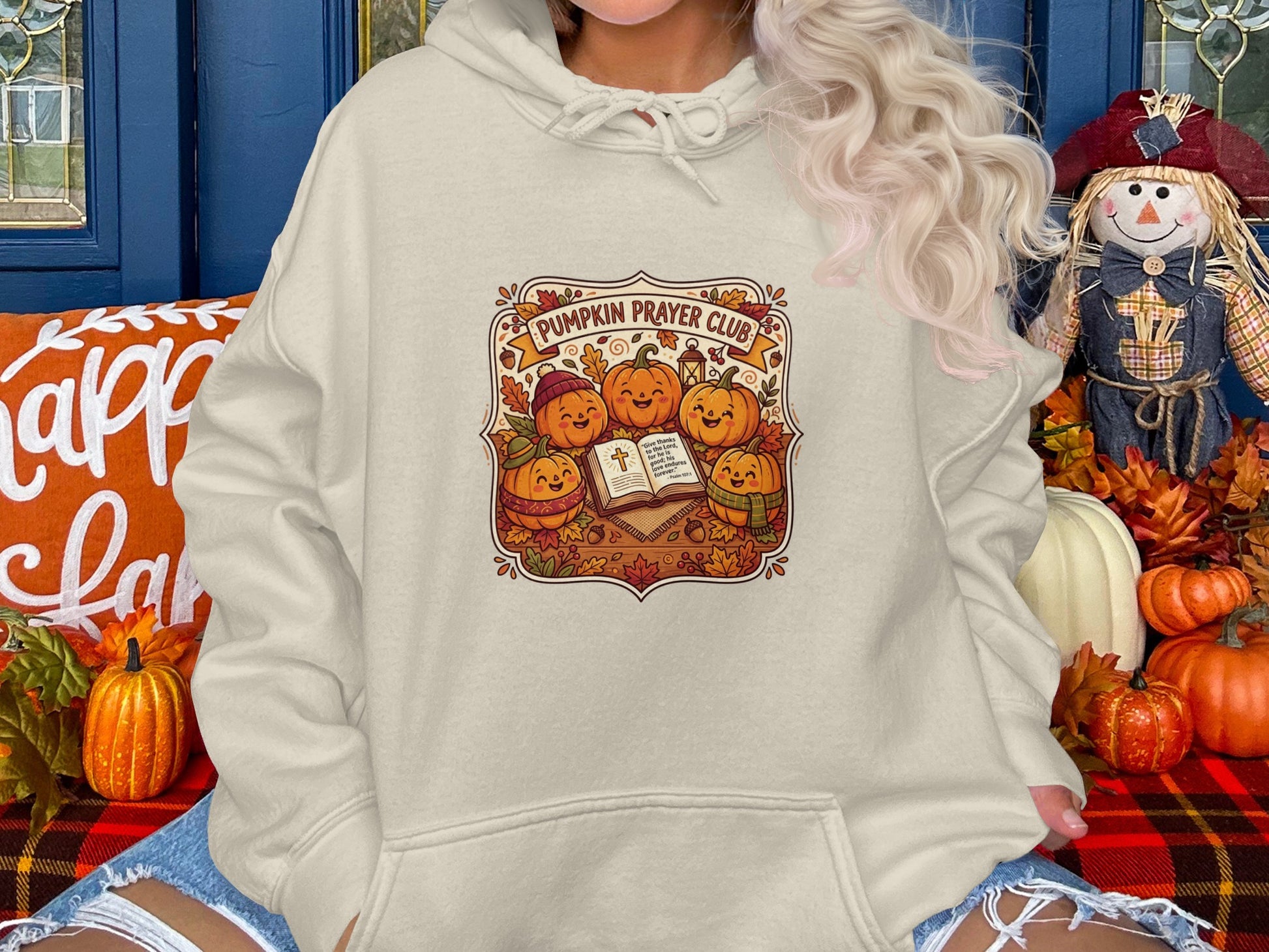 Cream hoodie with "Pumpkin Prayer Club" graphic, pumpkins, and bible verse.