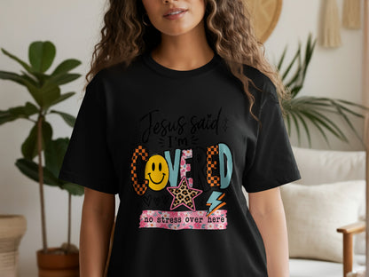 Black t-shirt with "Jesus said I'm covered no stress over here" graphic.