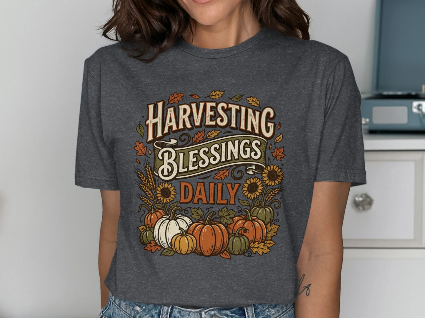 T-shirt with "Harvesting Blessings Daily" text and fall harvest graphic.