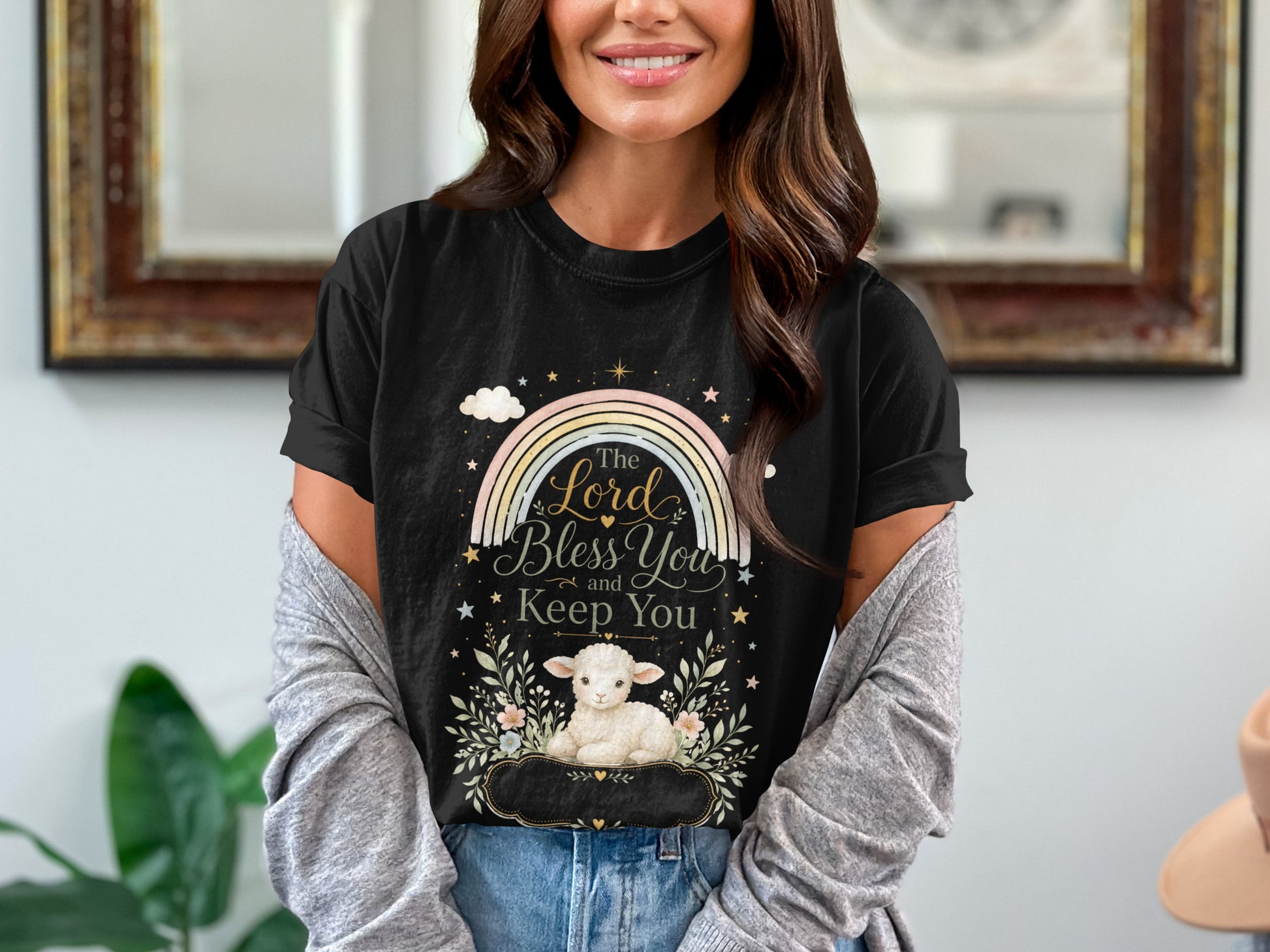 Black t-shirt with a rainbow, lamb, and text "The Lord bless You and Keep You".