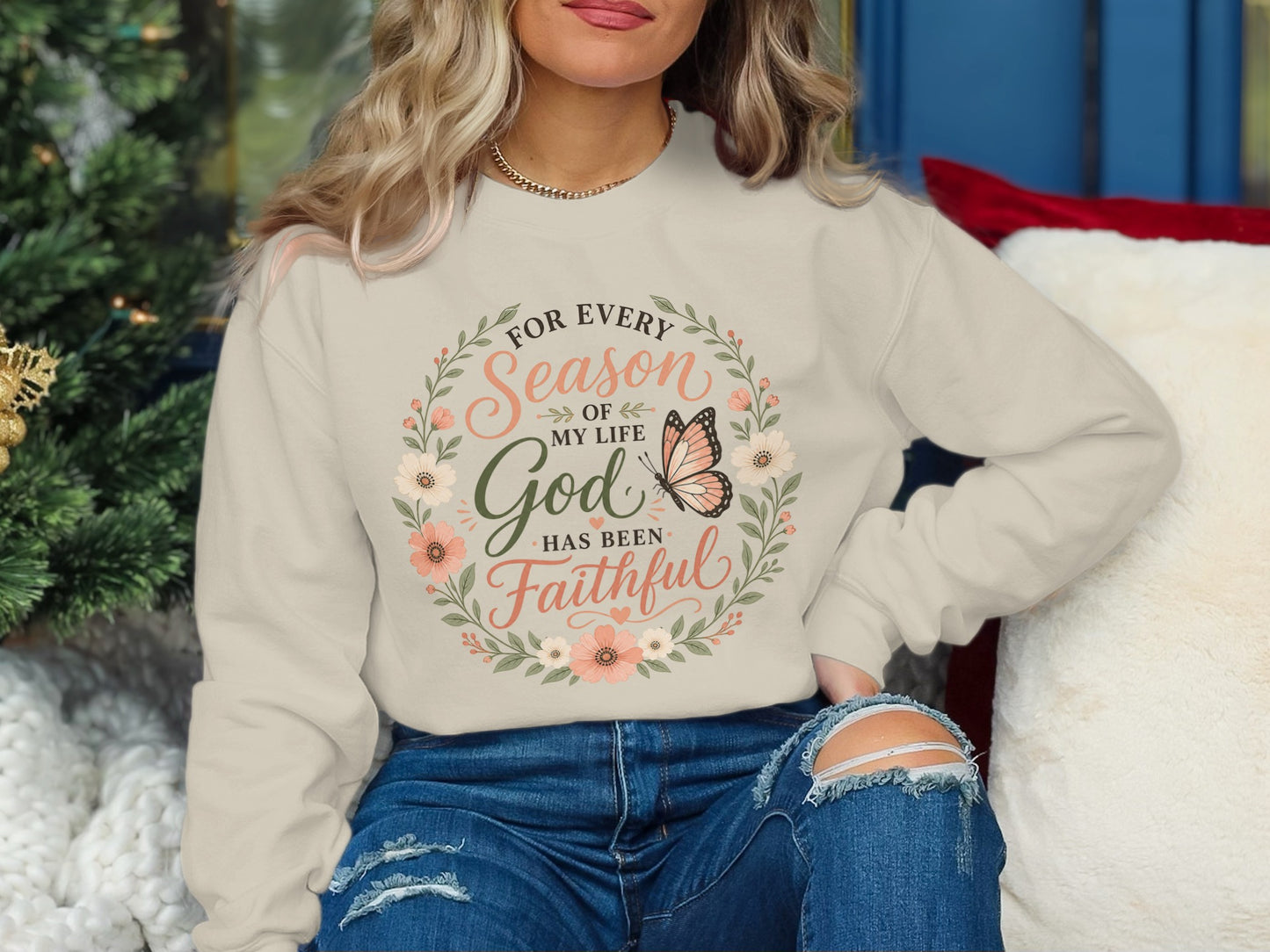 Cream sweatshirt with floral wreath and "For every season of my life God has been faithful" text.