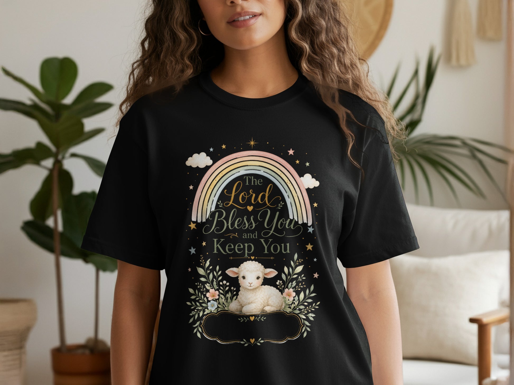 Black t-shirt with a rainbow and lamb graphic reading "The Lord Bless You and Keep You".