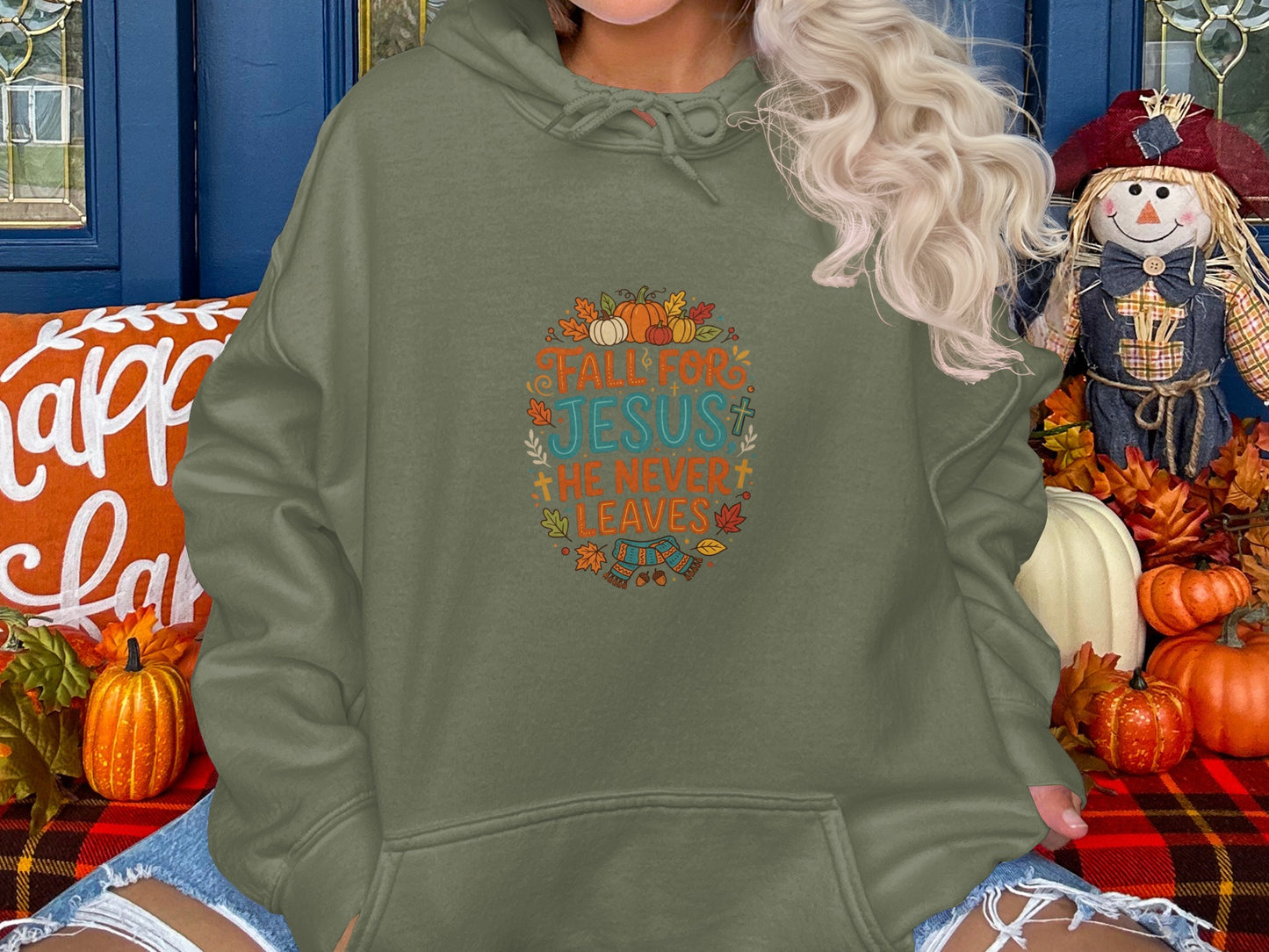 Green hooded sweatshirt with "Fall for Jesus, he never fails" text and fall graphics.