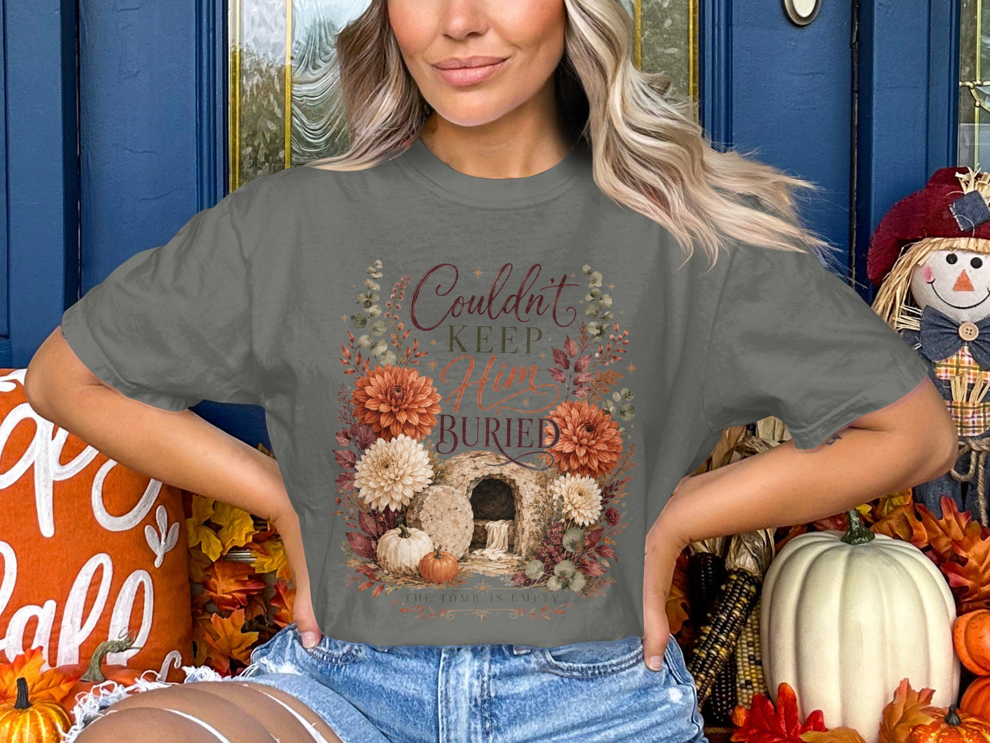 Gray t-shirt with "Couldn't keep Him buried" text and floral tomb graphic.