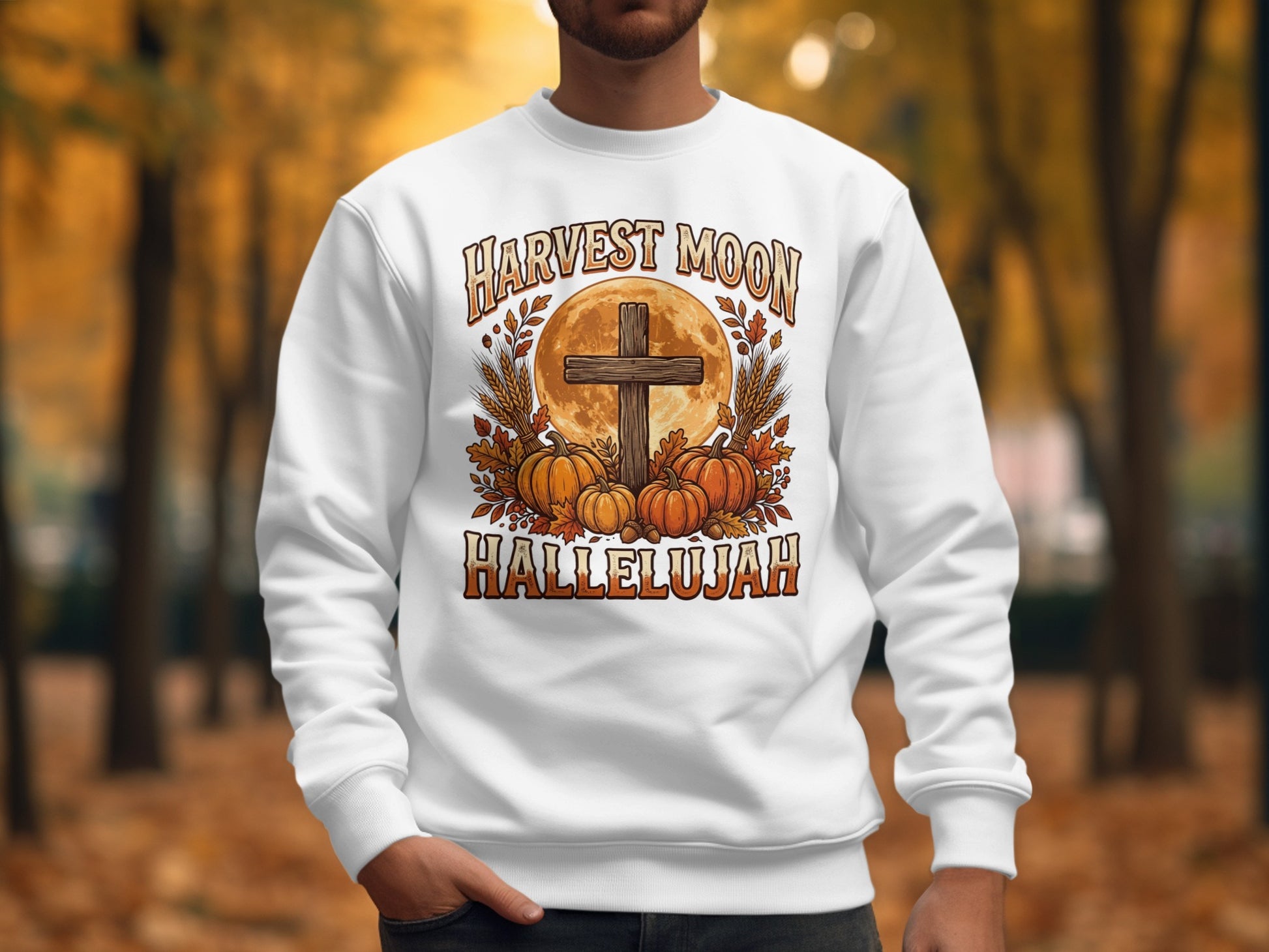 White sweatshirt with "Harvest Moon Hallelujah" text, cross, and pumpkins.