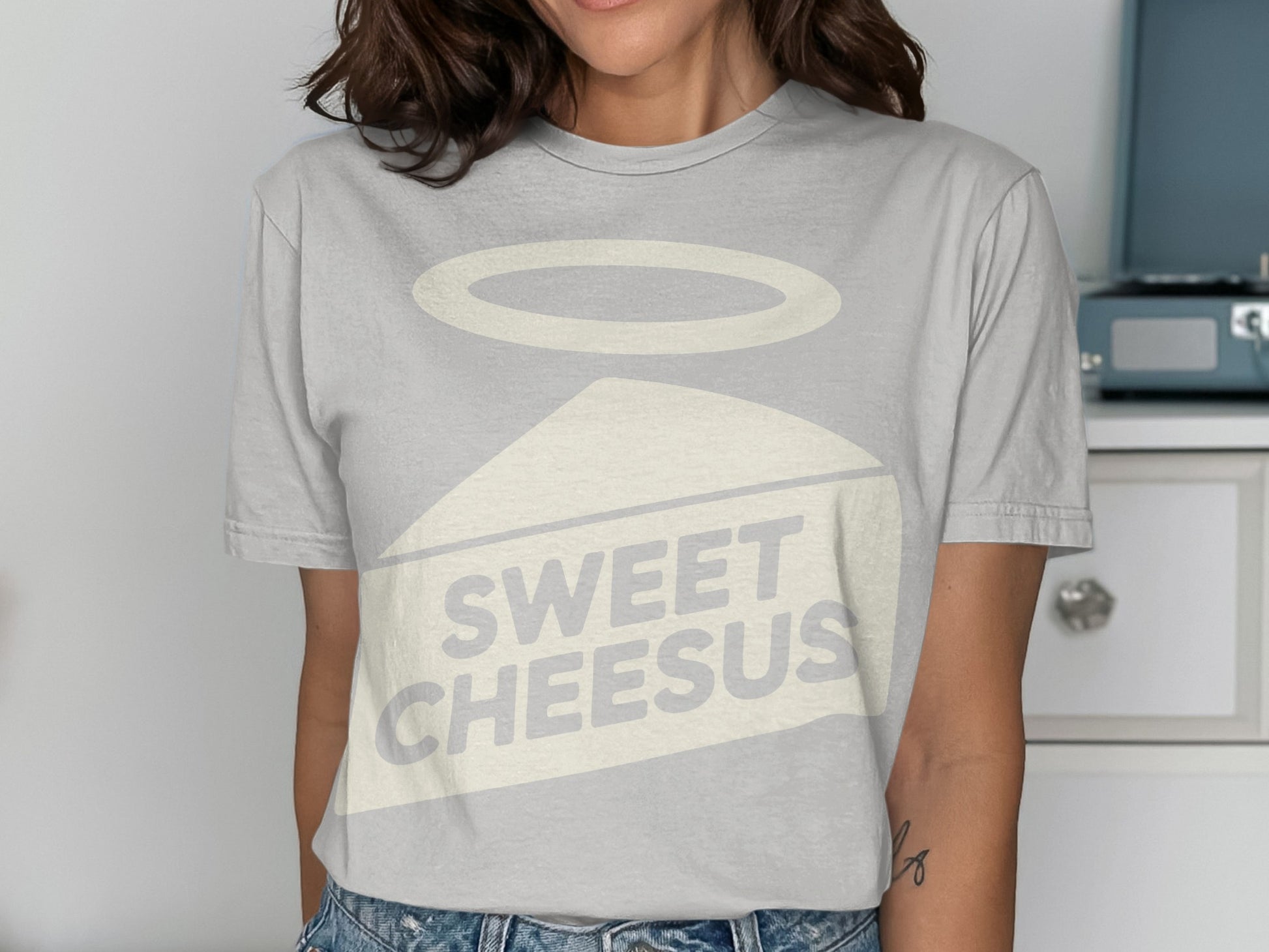 Gray t-shirt with a slice of cheese graphic and text "SWEET CHEESUS".