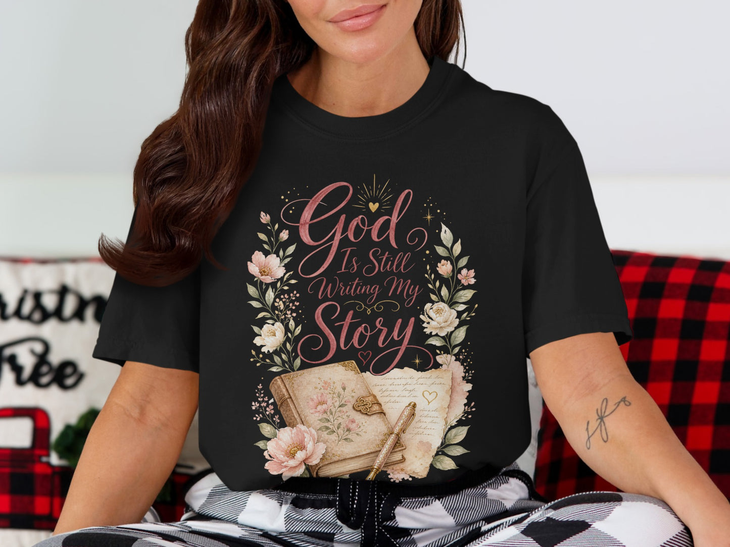 Black t-shirt with floral design and text "God Is Still Writing My Story".