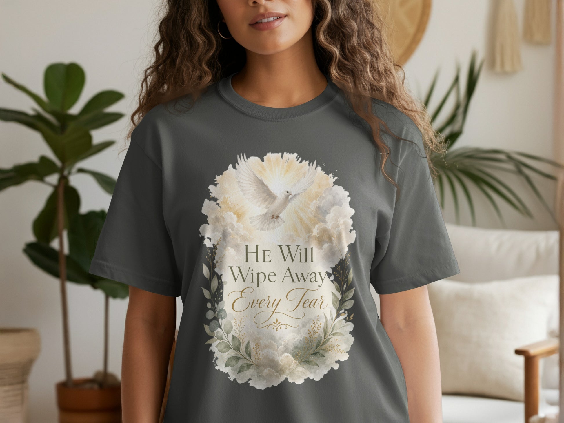 Charcoal t-shirt with a dove encircled by clouds and text that reads "HE Will Wipe Away Every Tear."