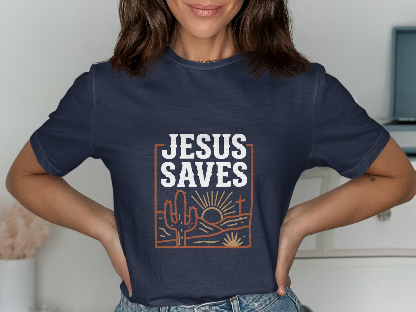 Navy t-shirt with "JESUS SAVES" text and desert scene graphic.