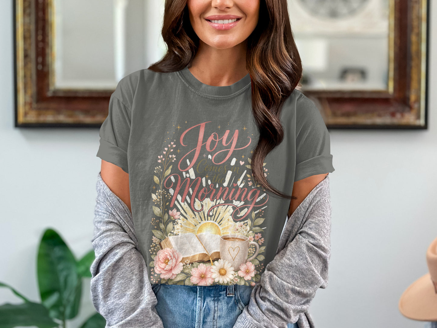 T-shirt with "Joy Comes in the Morning" text, open book, sun, and coffee.