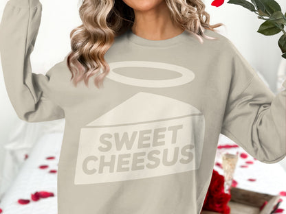 Cream sweatshirt with "Sweet Cheesus" text and halo graphic.