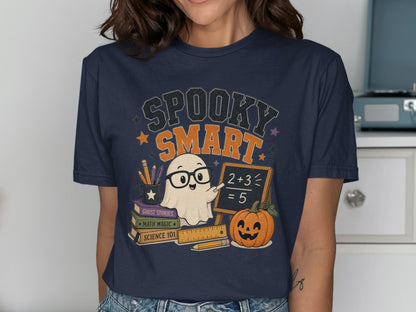 T-shirt graphic with "Spooky Smart" text, a ghost, books, and a pumpkin.
