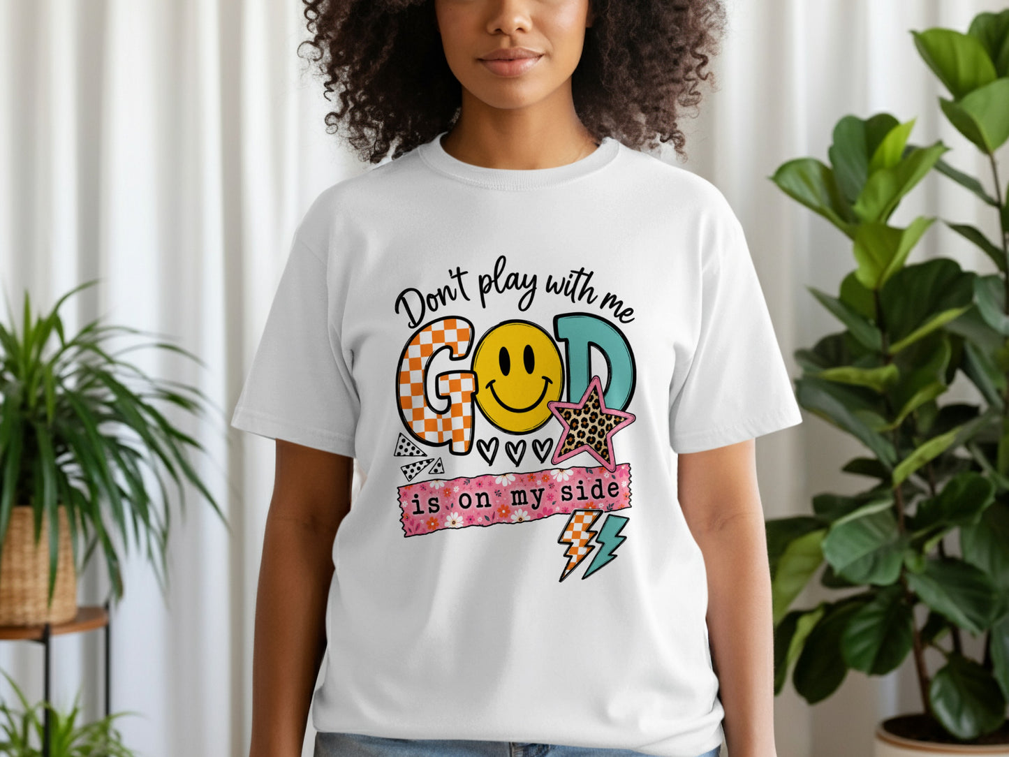 White t-shirt with graphic text that reads "Don't play with me, GOD is on my side."