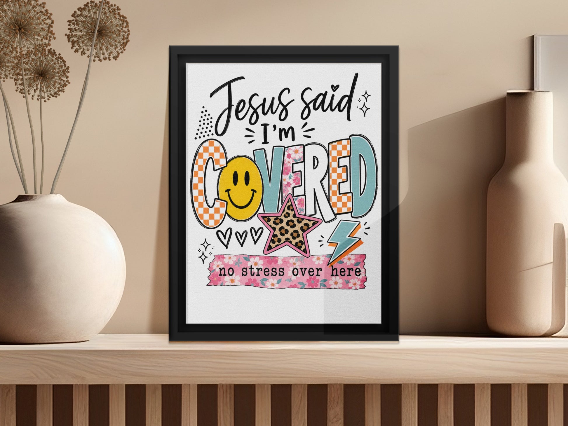Framed art with "Jesus said I'm COVERED" and "no stress over here" text.