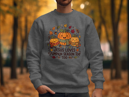 Grey sweatshirt with "Jesus loves pumpkin season too" text and smiling pumpkins.