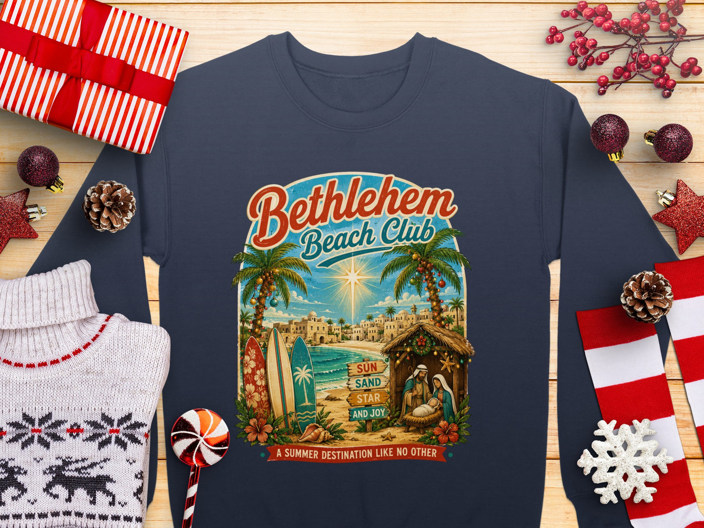 Bethlehem Beach Club sweatshirt with nativity scene, palm trees, and text.