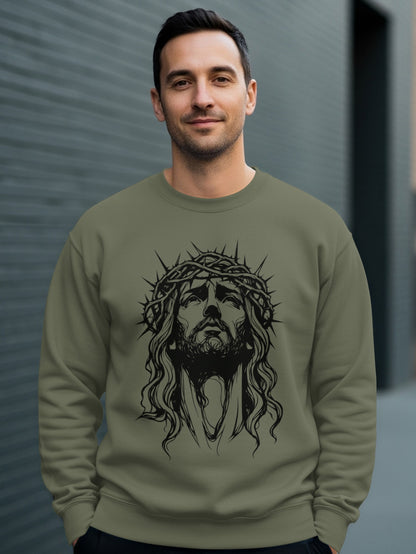 Man wearing a dark green crewneck sweatshirt with Jesus Christ graphic.