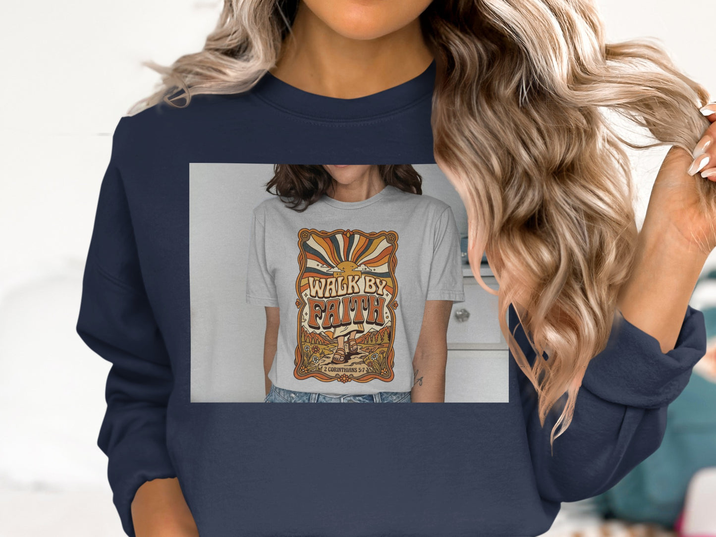 Dark navy sweatshirt featuring a graphic t-shirt with "Walk by Faith" text and sunburst.