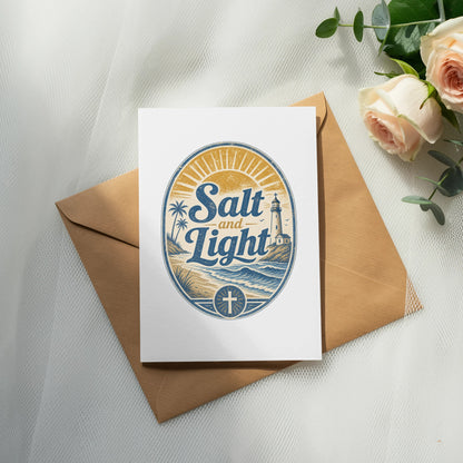 Card with "Salt and Light" text and beach scene, on a brown envelope.