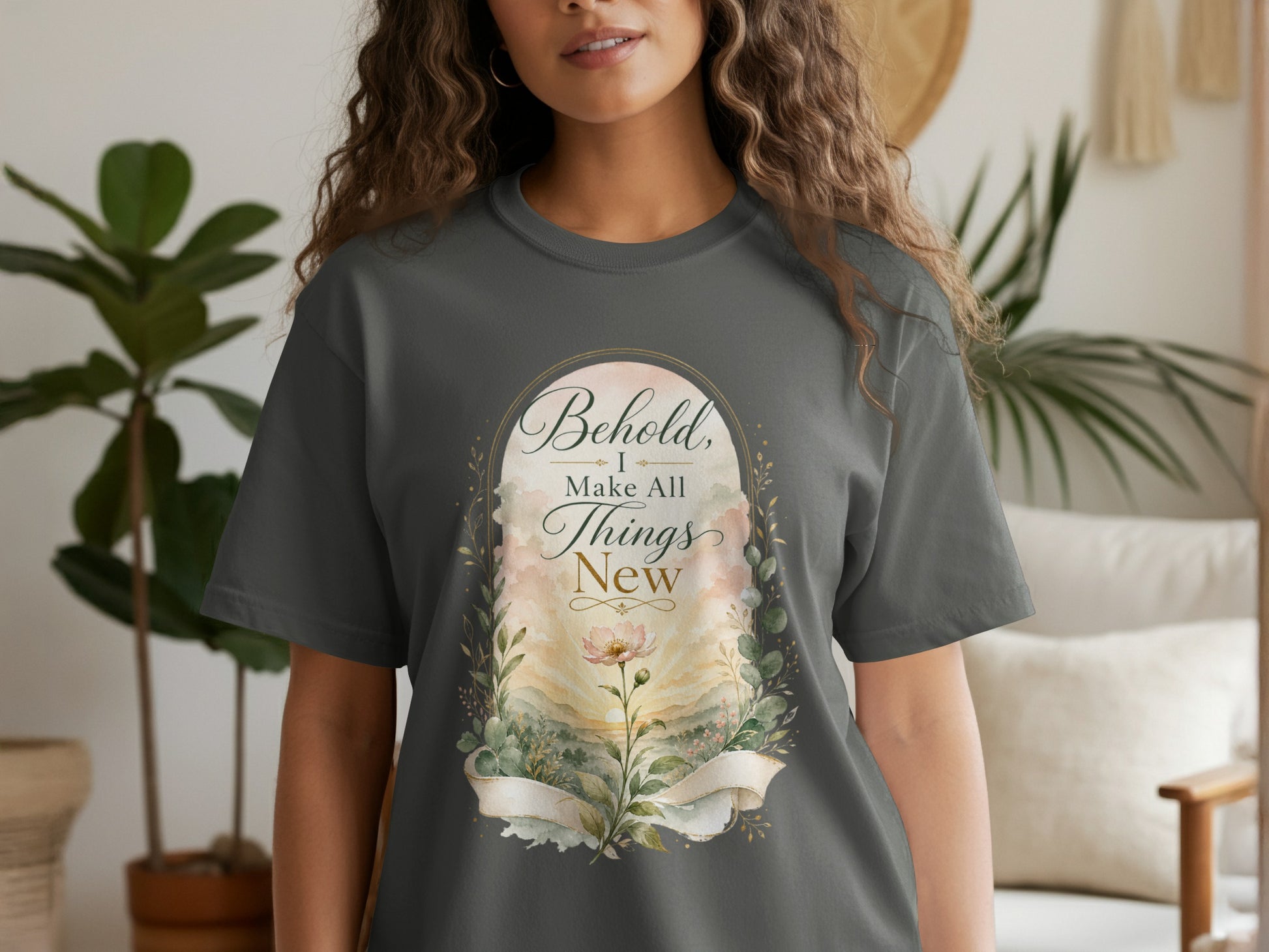 Dark grey t-shirt with "Behold, I Make All Things New" scripture graphic.
