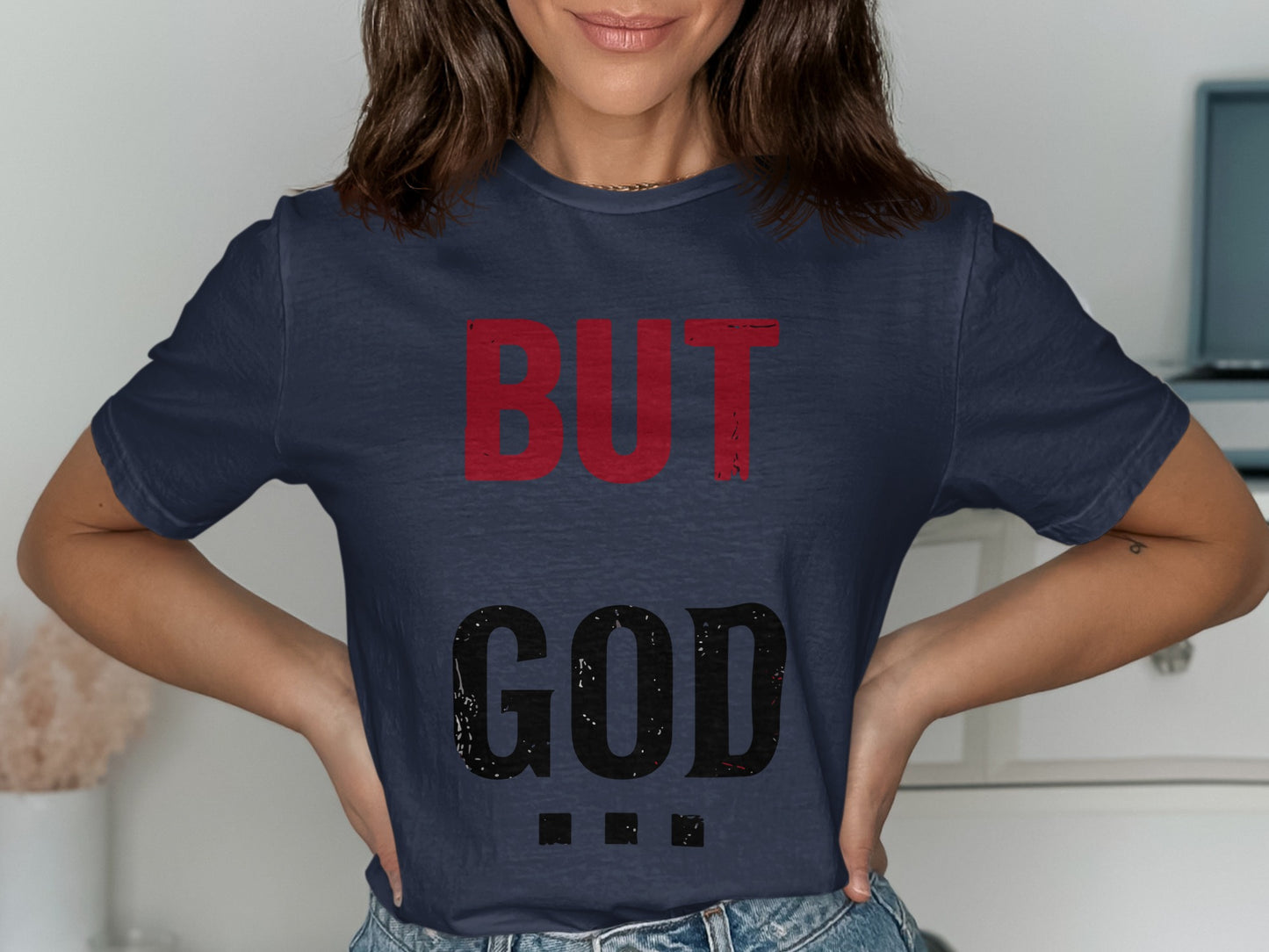 Dark blue t-shirt with "BUT GOD" in large red and black letters.