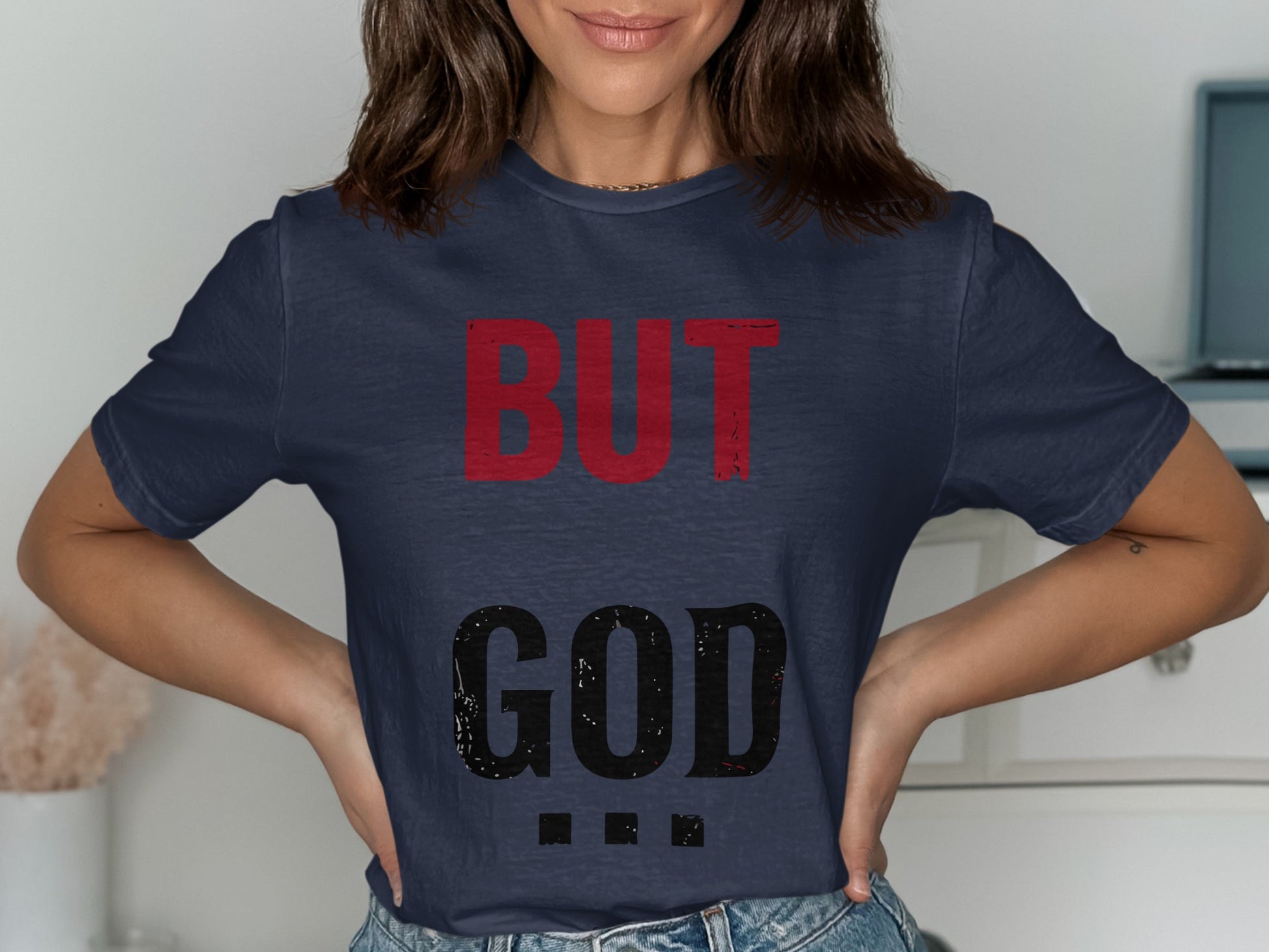 Dark blue t-shirt with "BUT GOD" in large red and black letters.