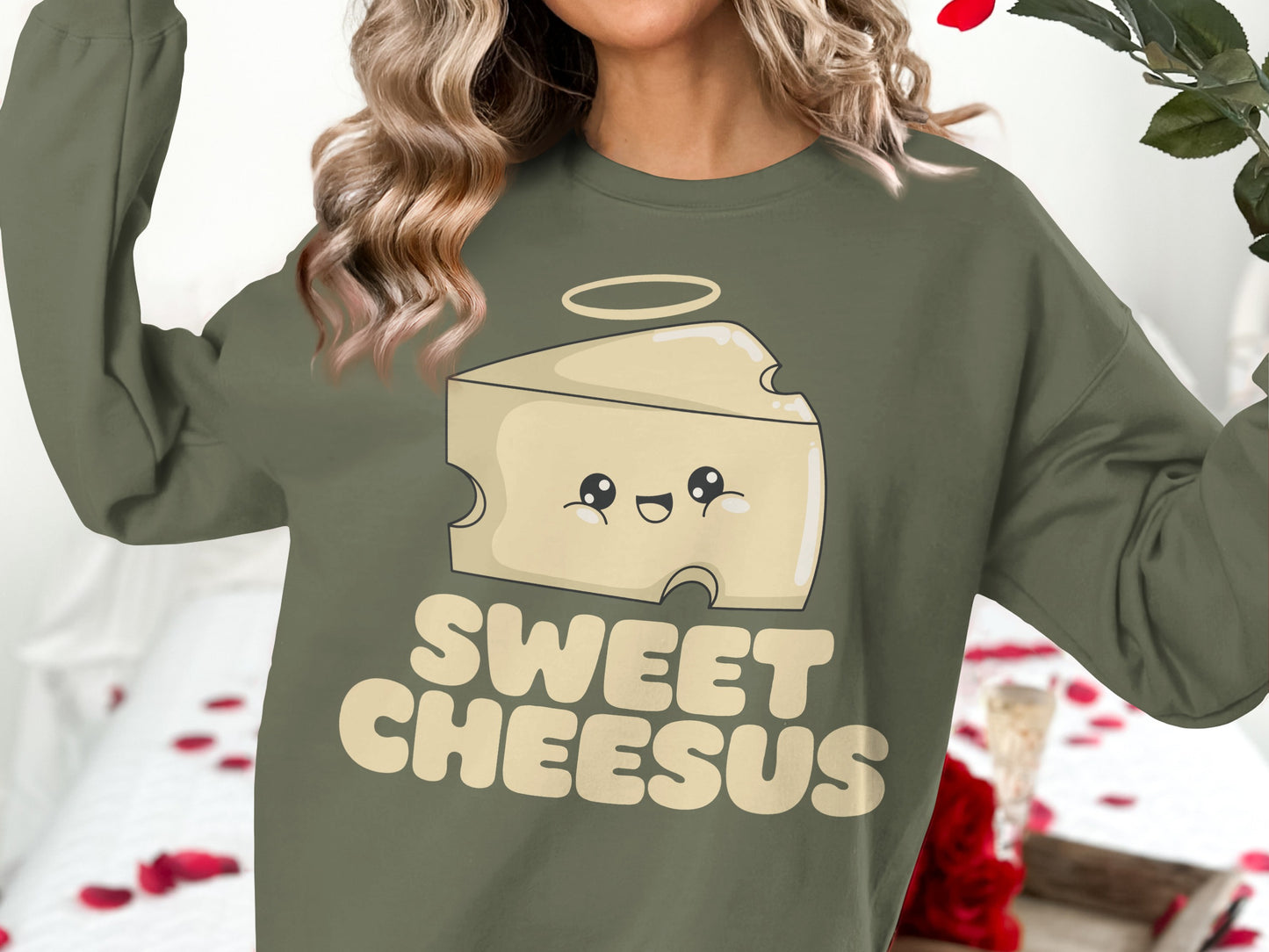 Green sweatshirt with a cartoon cheese slice and "Sweet Cheesus" text.