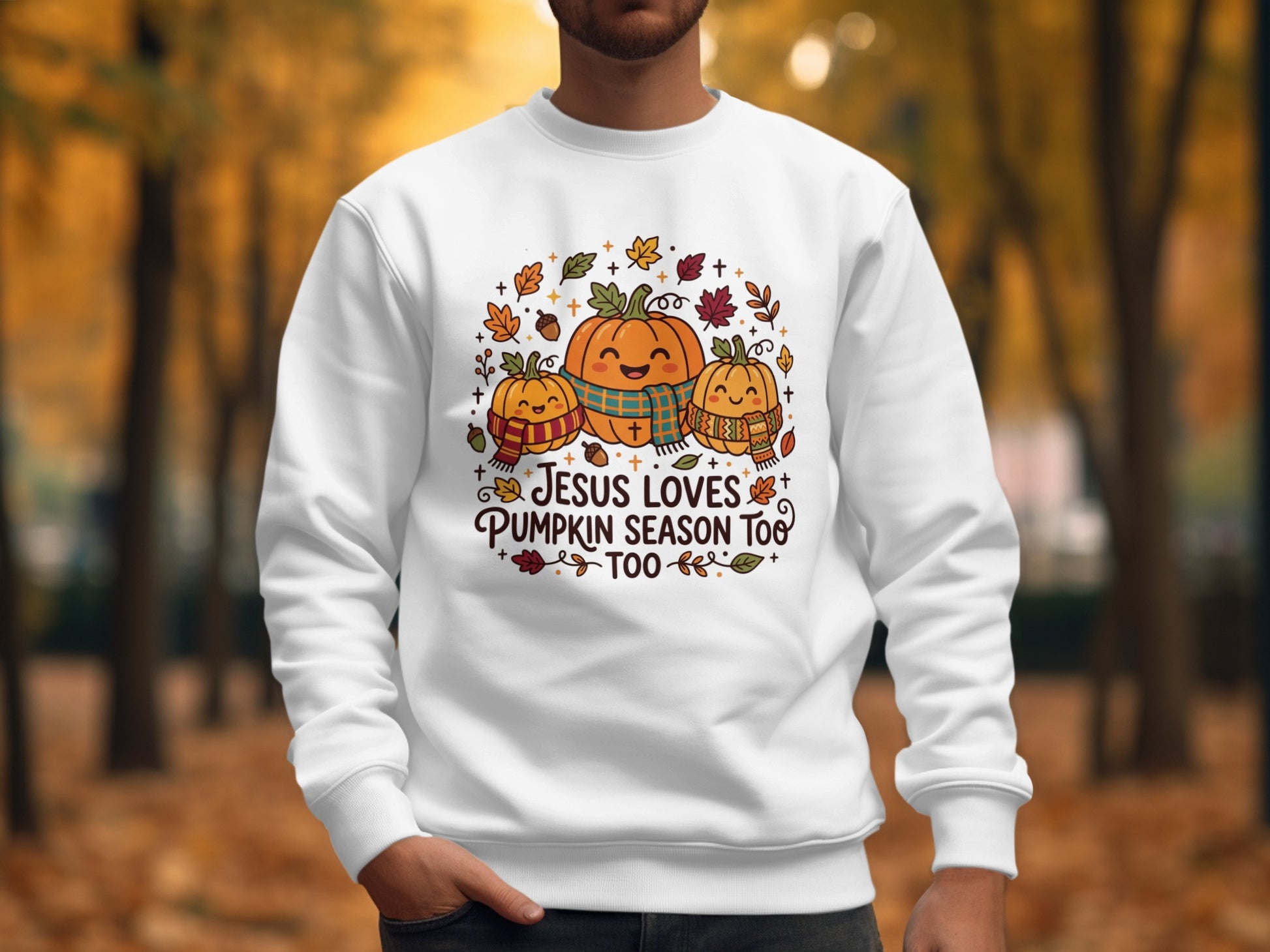 White sweatshirt with pumpkins and "Jesus loves pumpkin season too" text.