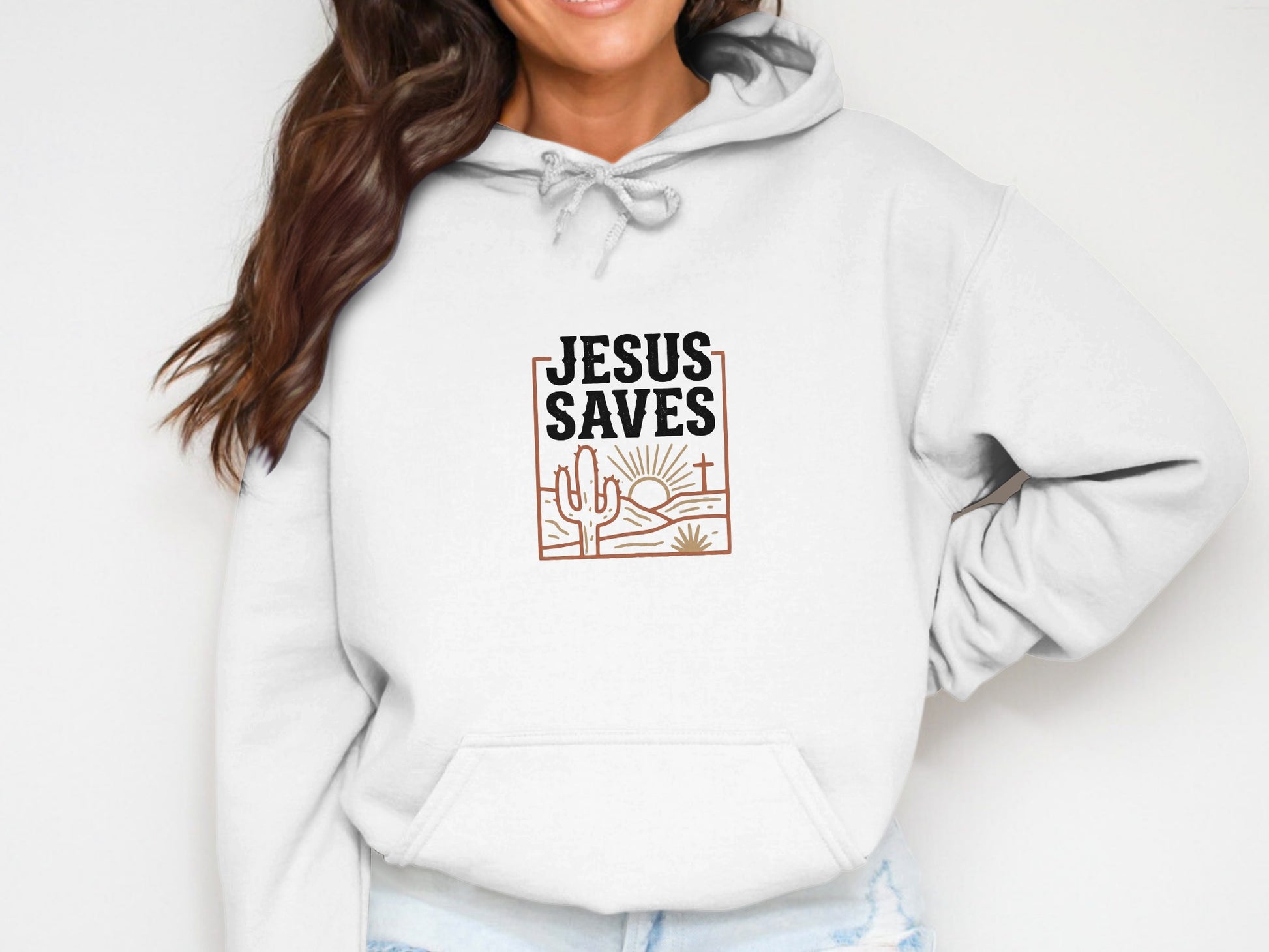 White hoodie with "Jesus Saves" text and a desert landscape graphic.