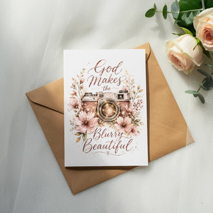 Greeting card with vintage camera illustration and text "God Makes the Blurry Beautiful".