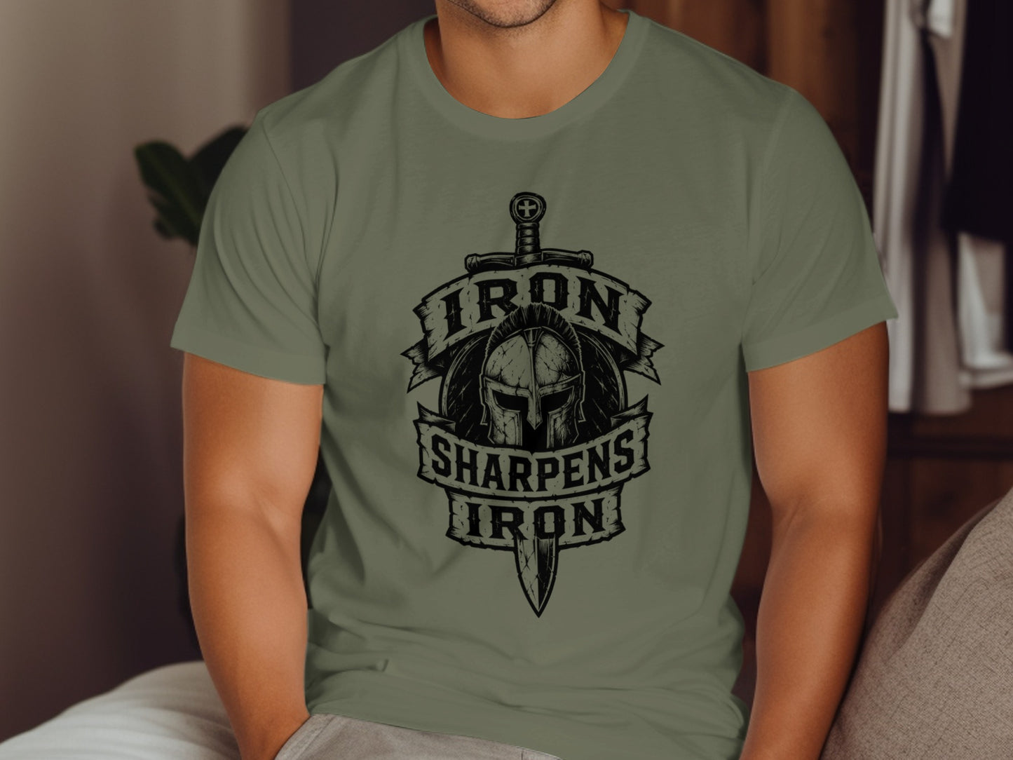 T-shirt with "Iron Sharpens Iron" text and helmet graphic.