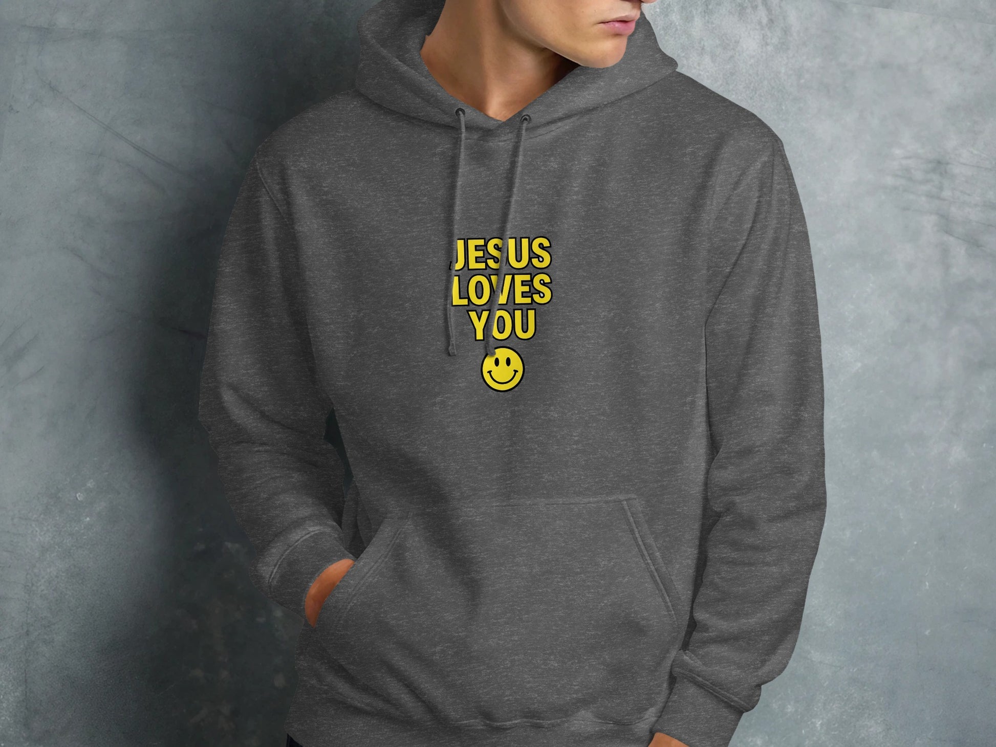 Dark grey hoodie with "JESUS LOVES YOU" and smiley face.
