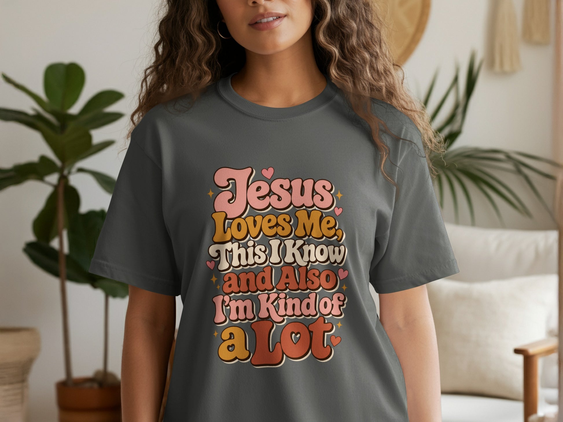 Dark gray t-shirt with "Jesus Loves Me, This I Know and Also I'm Kind of a Lot" text.