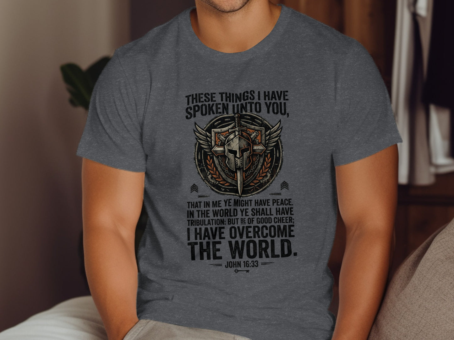 Grey t-shirt with John 16:33 Bible verse and knight helmet graphic.