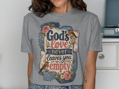 Grey t-shirt with "God's love never leaves you empty" text, flowers, and birds.